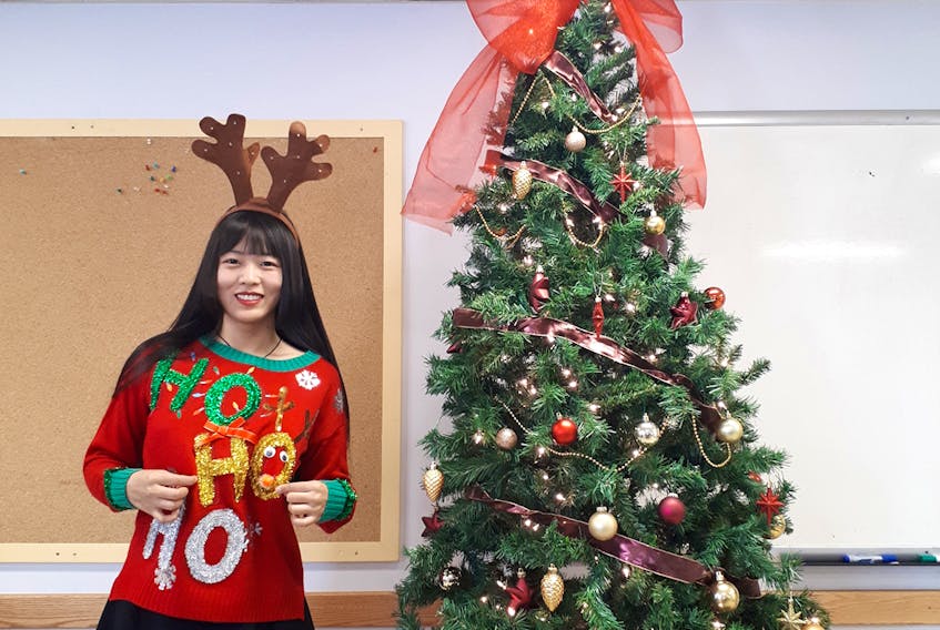 Lili Liu, a UPEI masters student from China, shows off her ugly Christmas sweater. She says that Christmas is similar to the Chinese New Year celebration. SUMITTED PHOTO