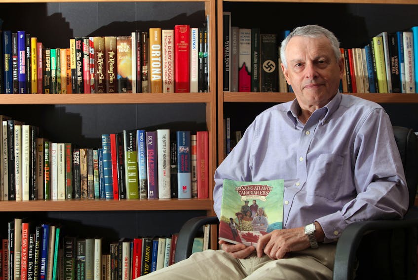 Author John Boileau in his study at his home.