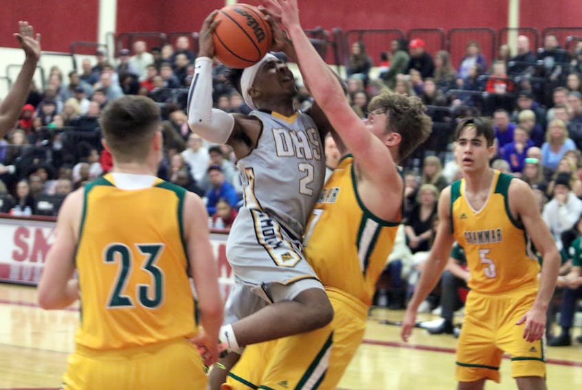Dartmouth Spartans’ Romie Smith (2) drives against as Halifax Grammar School Gryphons’ Ethan Marshall-Harris defends during action in the Capital Region high school boys’ basketball championship game on Sunday at Saint Mary’s.  Eric Wynne