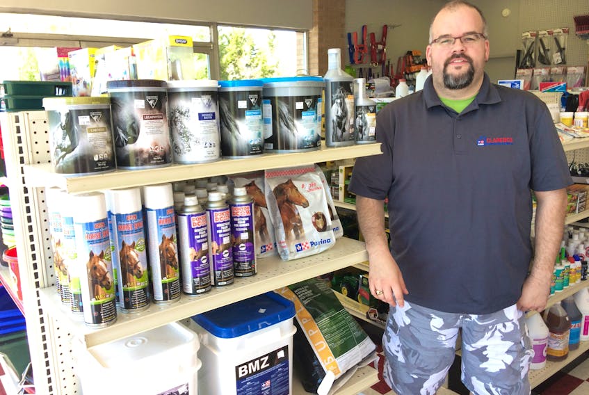 Greg Bishop, manager of Clarence Farm Services, looks over just some of the products available at the company’s Industrial Park Drive store. The store is holding a grand opening on Saturday, June 2 from 8 a.m. to 1 p.m.