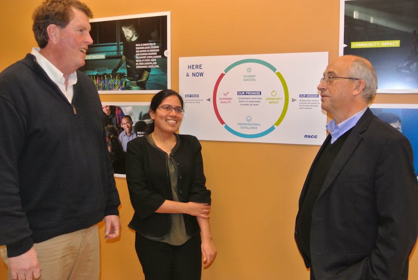 Nova Scotia Community College Amherst Learning Centre principal Don McCormack (left) and student association president Eliza Kuriyapulli-Anthony talk to Nova Scotia NDP leader Gary Burrill during a visit to the campus on Monday.