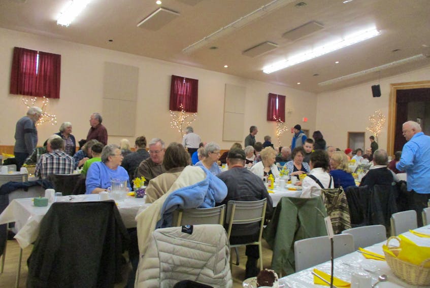 Attendees enjoy a pancake supper in Wentworth, located at the recreation centre.