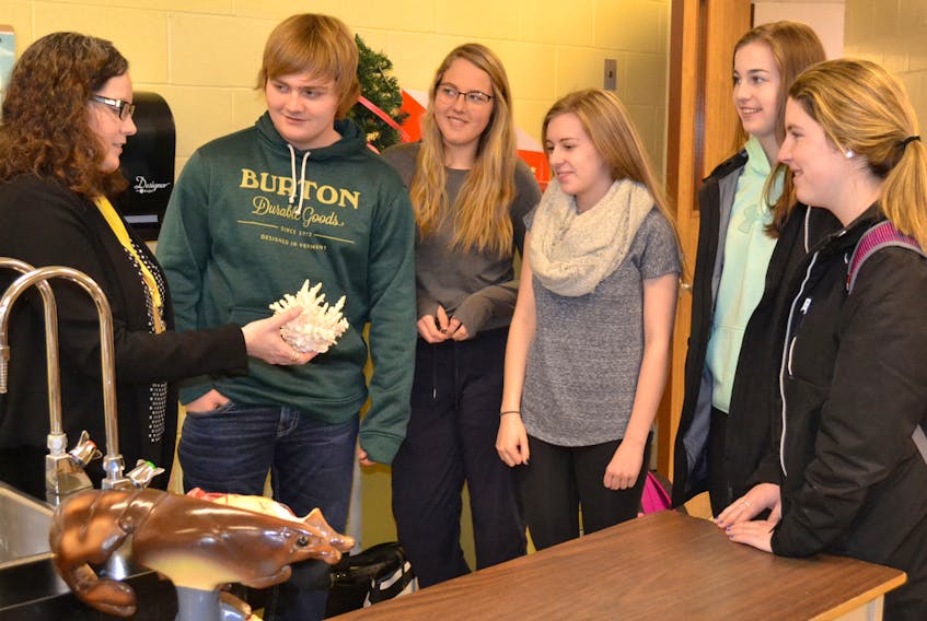 Dalhousie University professor, Sarah Stewart-Clark, explains the impact of rising acidity levels in the world’s oceans on shellfish to Westisle students, from second left, Jesse Gavin, Chloe Gaudet, Katie Shea, Shianne Handrahan and Keisha Doucette.  ERIC MCCARTHY/JOURNAL PIONEER