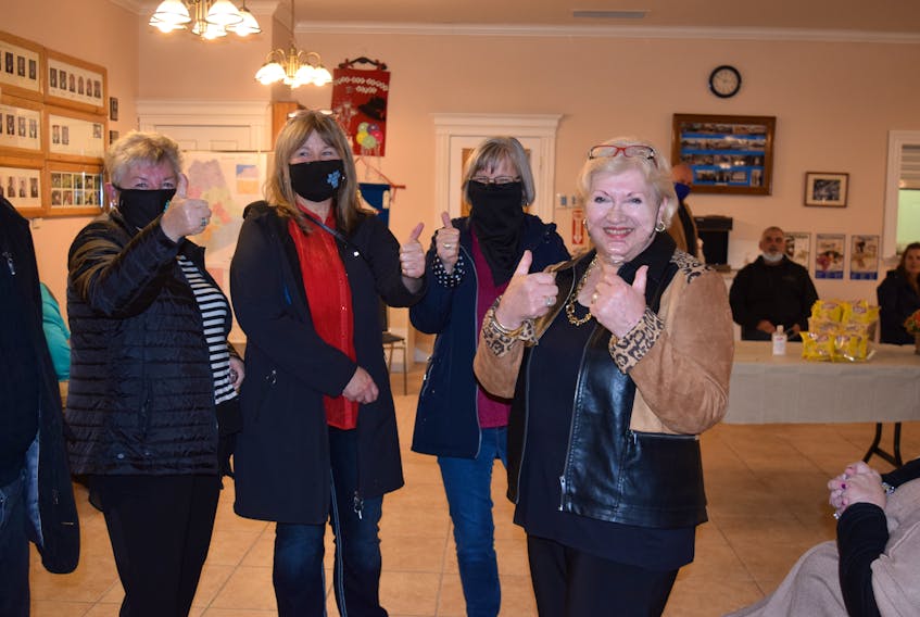 Christine Blair, at right, was all smiles after winning her second consecutive term as Colchester County's mayor on Saturday night. She is pictured with supporters, from left, Lois MacCormick, Debbie Pryor and Nancy Benton.