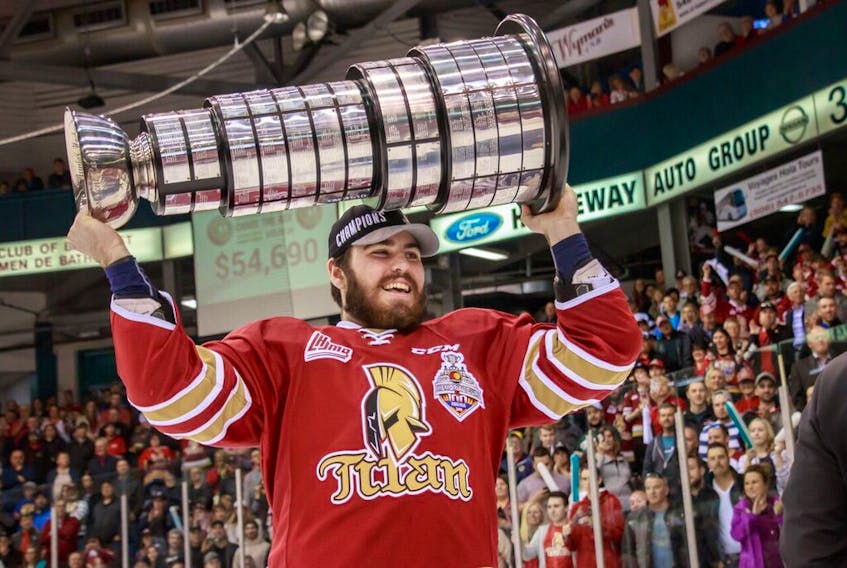 Zachary Bennett holds the President’s Cup, presented each year to the championship team for the Quebec Major Junior Hockey League.