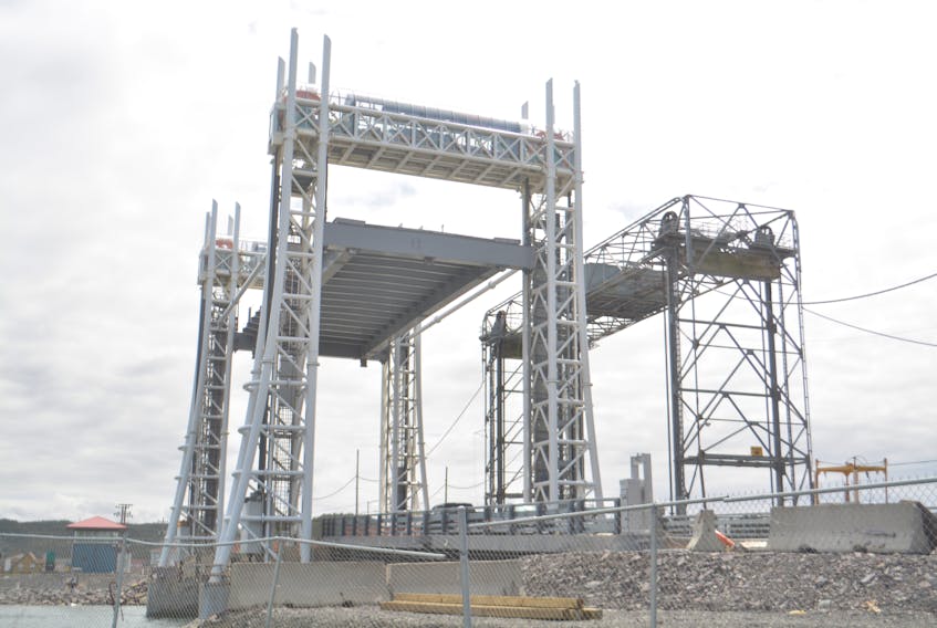 The Placentia lift bridge, pictured on the left next to its predecessor in a 2016 file photo, is reportedly stuck in a raised position.