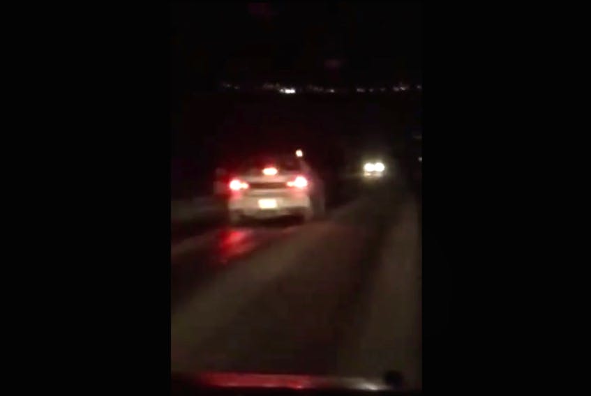 An image taken from a video Cathy Warren shared on Facebook Thursday night. The car on the left is driving directly into oncoming traffic.