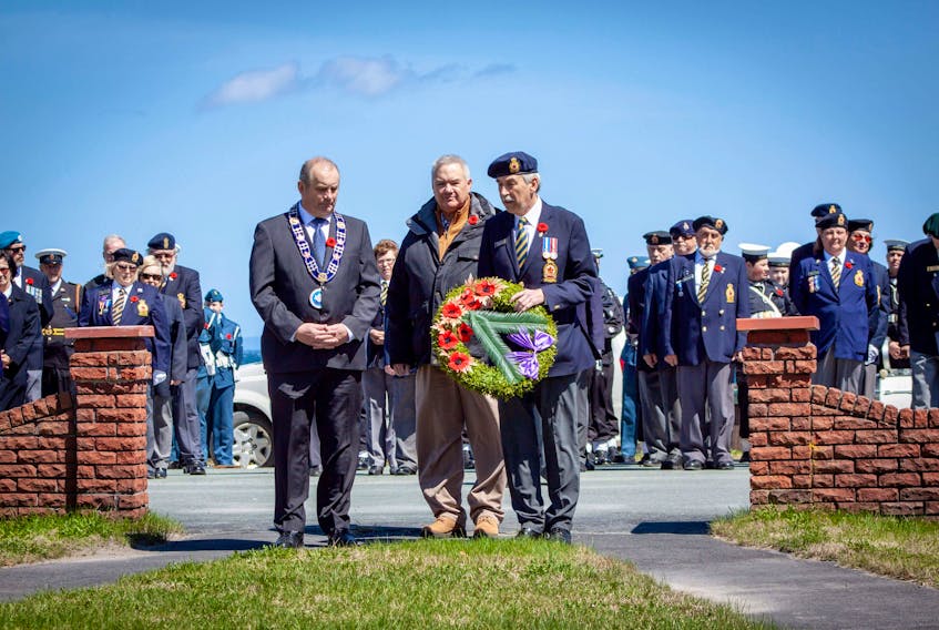 Mayors from three neighbouring municipalities placed a wreath in front of the war memorial in Spaniard’s Bay on Sunday, May 6. From left: Paul Brazil (Spaniard’s Bay), Gary N. Smith (Bishop’s Cove) and Philip Wood (Bay Roberts). — Photo courtesy Darlene Stamp