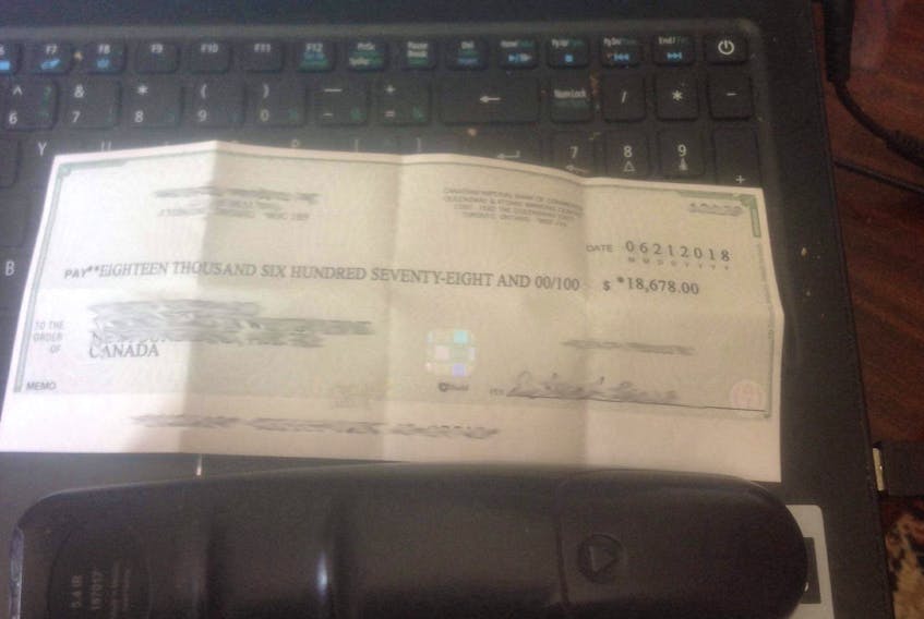 A man originally from Conception Bay North received this cheque for $18,000 from a group that he believes is running an online scam.