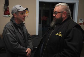 Carbonear Mayor Frank Butt, left, chats with U-Turn Drop-In Centre executive director Jeff Bourne at the Knights of Columbus building, where the group's second annual walk to recognize National Addictions Awareness Week concluded Tuesday night. — Andrew Robinson/The Compass