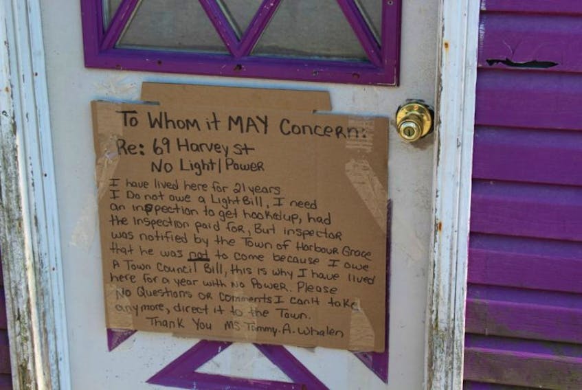 Tammy Whalen placed this sign on her front door following issues regarding unpaid bills.