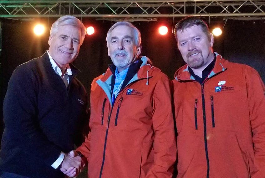Newfoundland and Labrador Premier Dwight Ball, left, shakes the hand of Bay Roberts Mayor Philip Wood, with recreation director Ian Flynn standing beside him. Wood and Flynn were in Deer Lake over the weekend for an announcement officially proclaiming Bay Roberts as host of the 2020 Newfoundland and Labrador Summer Games.