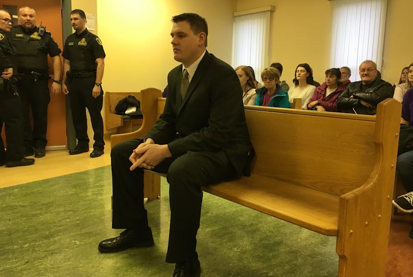 Brian King takes a seat prior to the arrival of a judge in the courtroom Monday. — Andrew Robinson/The Compass