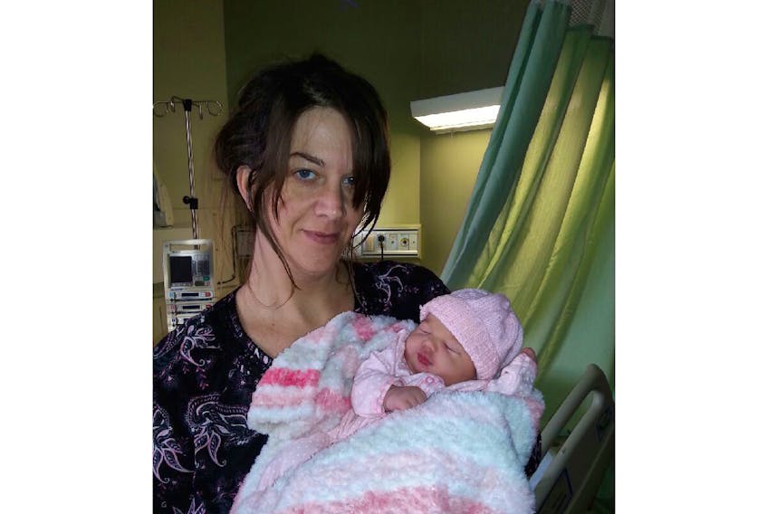 The birth earlier this month of Eva Hunt-Gilbert, pictured in the arms of her mother Susan Hunt, proved to be a first for both Carbonear General hospital and the mom.