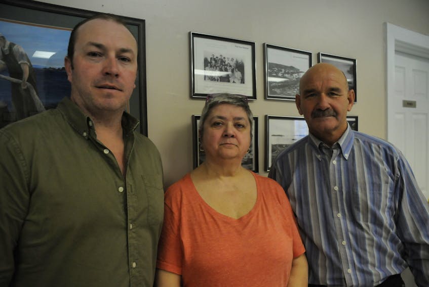 From left, are three members of a committee working to establish the first war memorial in Freshwater, Conception Bay — Darryl Parsons, chairwoman Lynne Priddle and treasurer David Moriarity.