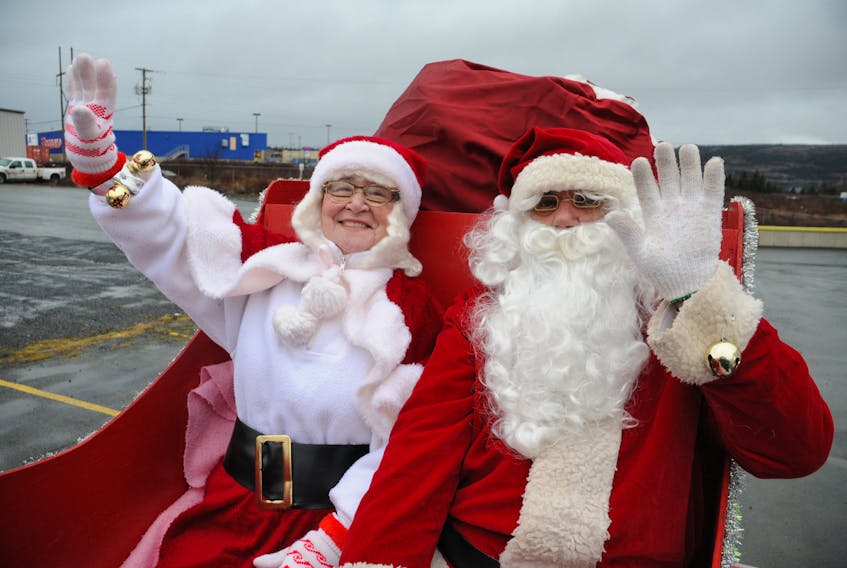Mary Power, left, and George Power are pictured filling the shoes of Mrs. Claus and Santa Claus at the 2012 parade in Carbonear. This year’s parade marked George’s last wearing Santa’s red suit.