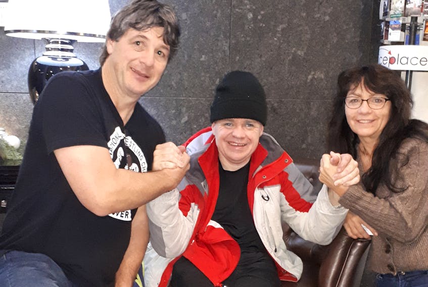 Chris Scott (left), Garry Kell and Paula O'Connell celebrate their medal wins at the International Federation of Armwrestling World Championships in Rumia, Poland. Kell and O'Connell are Antigonish natives. CONTRIBUTED
