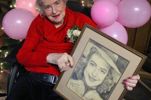 Mary MacGillivray holds a self-portrait she made in 1942 during her 100th birthday celebration Nov. 23 at the R.K. MacDonald Nursing Home in Antigonish. Corey LeBlanc