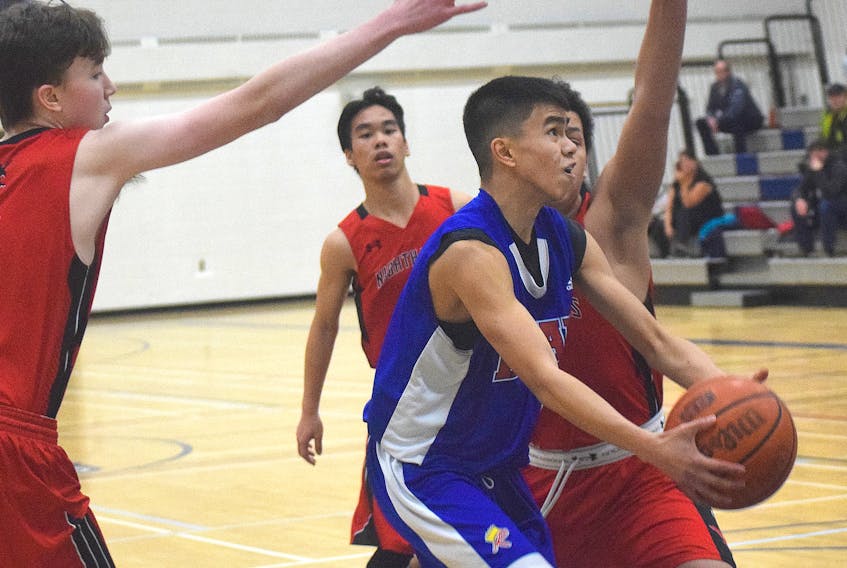 Christian Vitug of the Dr. John Hugh Gillis Regional Royals splits the host Northumberland Nighthawks’ defense during tournament action last month in Alma, Pictou County. Kevin Adshade/THE NEWS