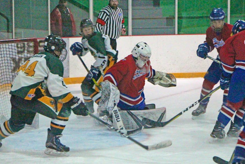 Matthew MacEachern of the Dr. John Hugh Gillis Regional Royals makes a save through heavy traffic during a 7-5 round-robin victory over the Memorial Marauders during the 2019 Millennium Cup at the Antigonish Arena. Corey LeBlanc