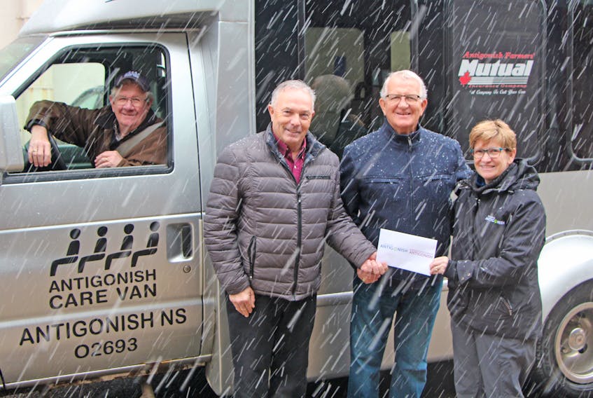 Warden Owen McCarron of the Municipality of the County of Antigonish and Mayor Laurie Boucher of the Town of Antigonish recently made their annual municipal contributions to the Antigonish CARE Van Society. Society chairman Bob Hillier accepted the monies, while volunteer driver Roy Lawlor stopped by with the vehicle after making a run. Corey LeBlanc