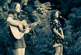 Sisters Moira and Claire MacMillan, shown during one of their on-stage performances, recently released "No Snow", their third single. They call it a “quirky Christmas tune.” CONTRIBUTED