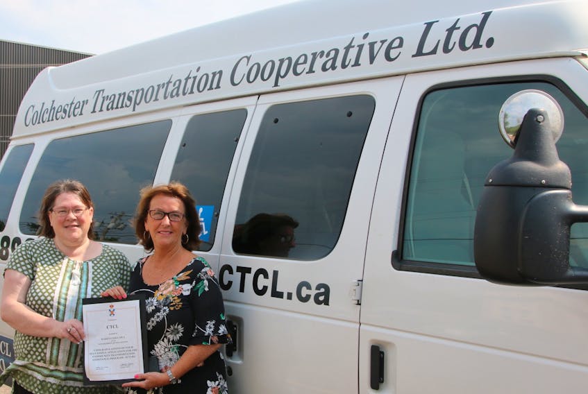 Susan Taylor, CTCL manager, left, and Colchester North MLA Karen Casey got together for a presentation recently. The provincial government provided $172,492 in funding to the transportation service for the coming year.