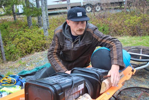 Neil Hamilton, of Peterborough Ont., is on a cross-country trek to raise awareness about Post-Traumatic Stress Disorder (PTSD) and mental health issues. The 28-year-old started the Newfoundland and Labrador section of his journey in St. John’s over the Easter weekend, late April. He is pictured loading his cart as he prepares to depart Gander, May 28.