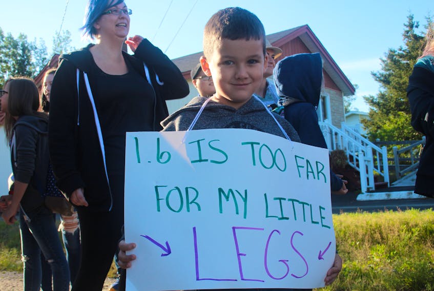 Instead of taking in his first day of school, four-year-old Jaxxon Parsons joined in the protest. In Centreville, because of the 1.6-km family responsibility zone, there are currently no bus stops for students in this section of the amalgamated community.