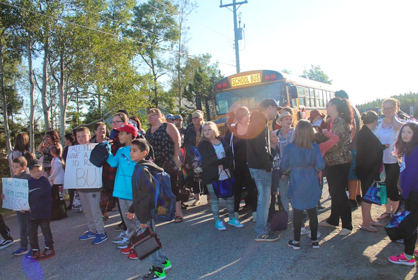 About 100 people turned out in Centreville-Wareham-Trinity Sept. 5 to protest a busing policy that prevents students living within 1.6 kilometres of the school from being picked up by the school bus.