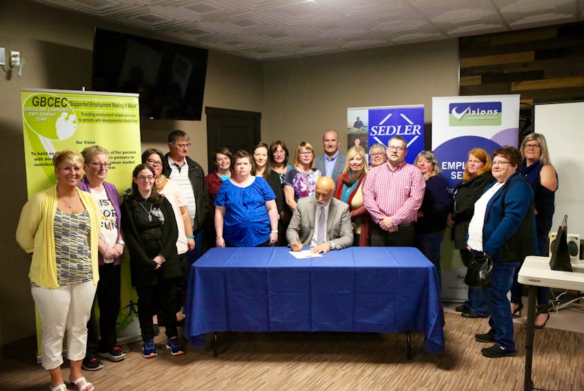Advanced Education, Skills and Labour Minister Al Hawkins signs the proclamation making October Supportive Employment Awareness Month. The signing was held during the opening ceremony of the 2018 Supported Employment NL conference, hosted this year in Springdale.
