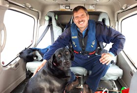 After a 28-day stint, principal lightkeeper Craig Burry and Molly, his three-year-old black Labrador retriever, head home to Wesleyville to spend time with family.