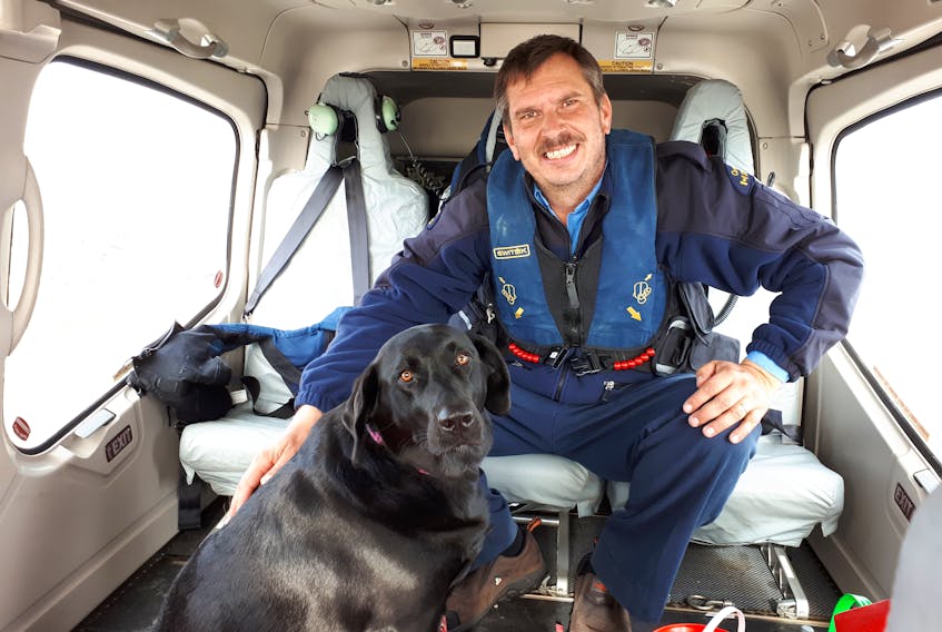 After a 28-day stint, principal lightkeeper Craig Burry and Molly, his three-year-old black Labrador retriever, head home to Wesleyville to spend time with family.