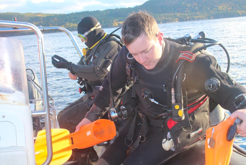 MUN associate professor Patrick Gagnon, left, and student Logan Zeinert prepare for a chilly dive in the shoal waters Baie Verte, Tuesday, Oct. 23. The two were scouting locations for a potential sea urchin farming pilot project in the area.