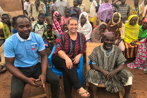 Yussif Adams (left), Canning’s co-worker from SEND Ghana, Samantha Canning, and a village Chief following a workshop in the Chief’s community.