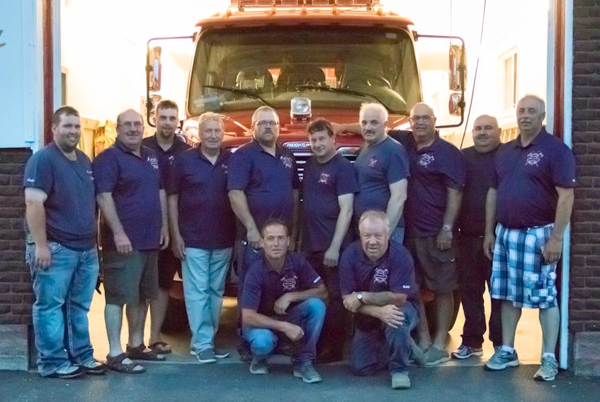 Several of Glovertown’s Fire Rescue members squeezed between the front garage doors at the current fire hall (front, from left) Warren Perry, Elias Feltham; (back) Curtis Abbott, Fire Chief Ken Parsons, Colton Gordon, Gus Briffett, Assistant Chief Jason Patten, Pleman Oram, Wade Sparkes, Tom Parsons, Mike Ralph and Jerry Saunders.