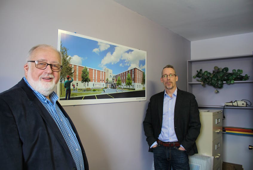 Allan Bradley, left, and Dr. John Campbell with concept drawing of the Lionel Kelland Hospice. The proposed palliative care unit for Grand Falls-Windsor has been in the works since 2014.