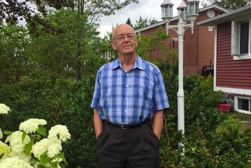 Rev. Arthur Elliott, pictured in his garden in Lewisporte, is a dedicated volunteer with a focus on broad, long-term community issues.