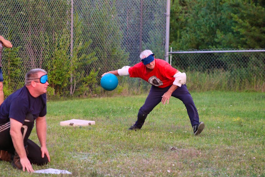 Campers Bruce Barrett, left, and John Stairs face off against Lions Club members in a friendly game of goal-ball at the Canadian Council for the Blind Adult Camp at Max Simms Memorial Campground Aug. 13.