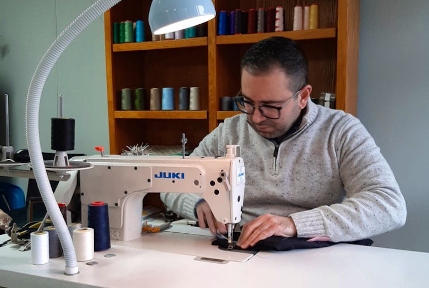 Sherzad Ibrahim operates Sherzad’s Tailoring Shop, which now has two locations: one downtown in the Halifax Brewery Farmers’ Market and the other on Esquire Lane in Bedford. Sherzad is pictured above at work in the Bedford shop.