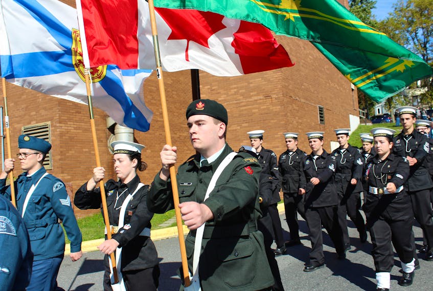 Mitchell Miller, from right, and Paula Barrie marched as part of the colour guard in Saturday’s parade, which honoured all cadet units within the Cape Breton Regional Municipality.