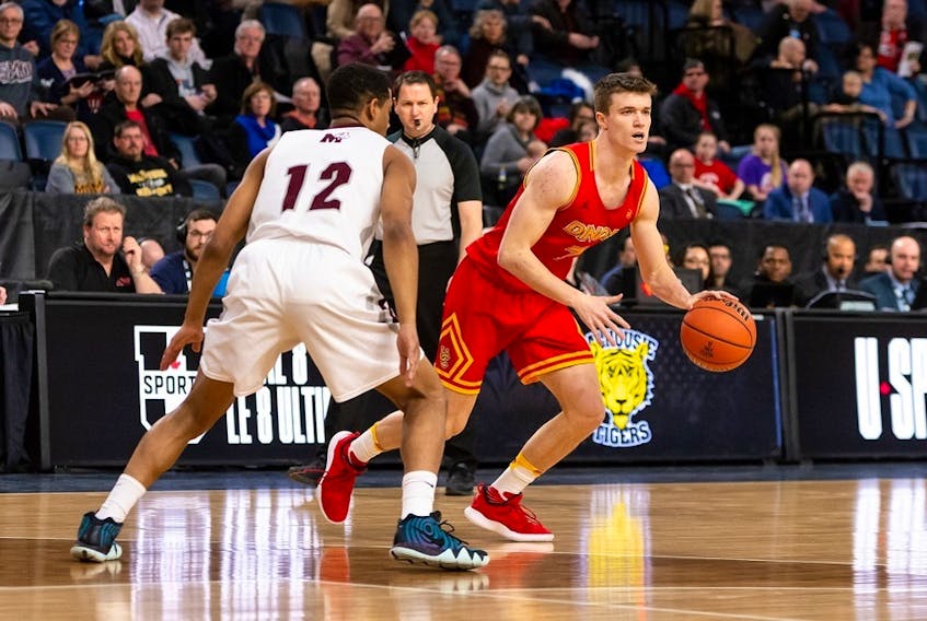 Saint Mary's Huskies' Kemar Alleyne guards Calgary's Max Eisele during a U Sport Final 8 championship quarter-final Friday at Scotiabank Centre. THe Dinos won 94-78.