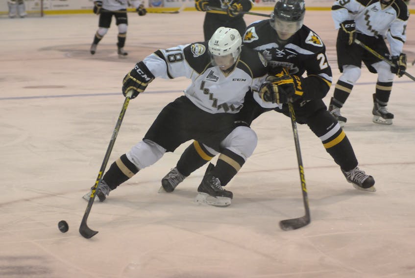 Chris Chaddock fends off a Cape Breton Screaming Eagles’ defender during a Quebec Major Junior Hockey League game while playing for the Charlottetown Islanders. Chaddock will make his Summerside D. Alex MacDonald Ford Western Capitals’ debut on Saturday night.