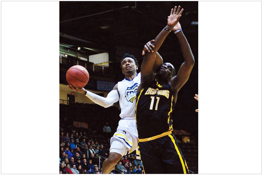 Keith Gosse/The Telegram — Alex Johnson of the St. John's Edge drives to the basket against Bryan Akinkugbe (11) of the London Lightning during NBL Canada action at Mile One Centre Tuesday night. The Edge won 126-123.