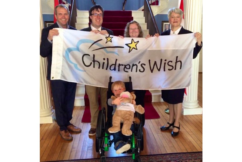 From left, Lt.-Gov. Antoinette Perry is joined by Kent Scales, CWF board member and national board representative, Wish parents Melanie and Aaron Brown and, in front, Wish child Gavin Brown.
