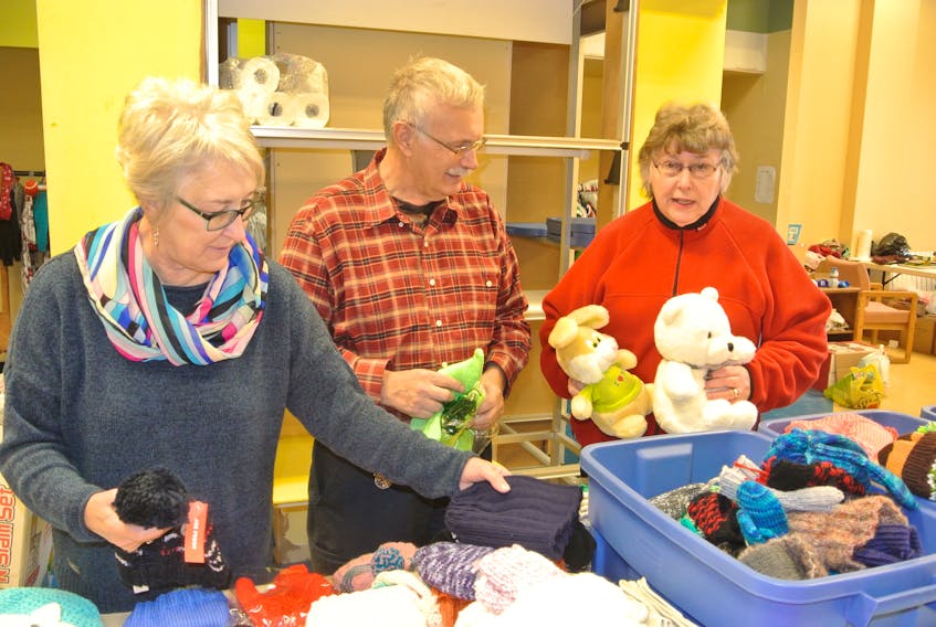 Volunteers Linda Bickerton and Lion Phil Baxter and Joan Fowler work in the Christmas for Kids centre in the Amherst Centre Mall. The program’s referral line at 902-667-1949 closes on Friday and after a slow start it appears as though the number of referrals will be pretty close to last year’s number.