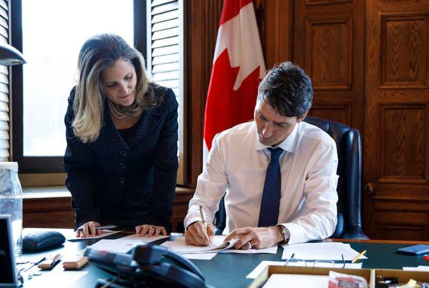 Prime Minister Trudeau and Foreign Affairs Minister Chrystia Freeland prepare for a press conference in Ottawa following the conclusion of USMCA negotiations. - Adam Scotti