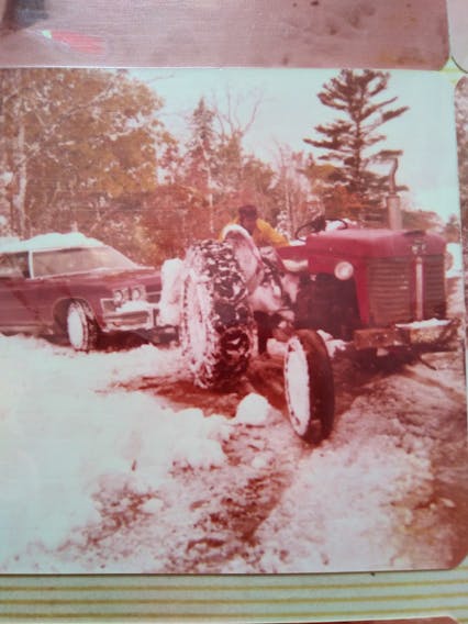 Cindy McAlpine MacKenzie submitted some wonderful photos with her story.  She says “the pictures aren't the best, Instant Polaroid from 1974, but pictures don't have to be great to spark a memory. She calls this one “- The rescue; we had to wait for our uncle Chuck to put chains on the tractor before coming down to pull us out.