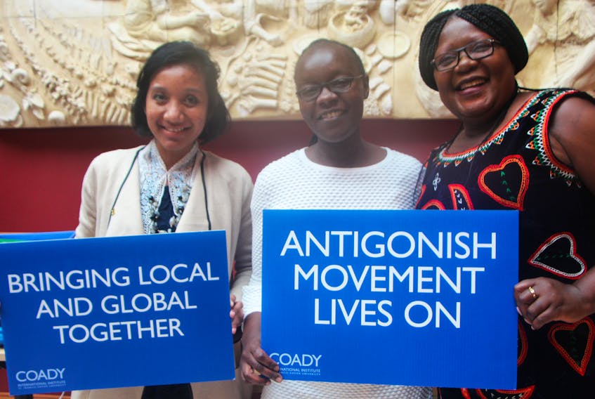 Nuri Istifarini (left) from Indonesia, Caroline Kisato from Kenya and Jacinta Foncha from Cameroon come together for a photo following the concluding session for the Coady International Institute’s Social Enterprise for Inclusive Local Economies course June 21.