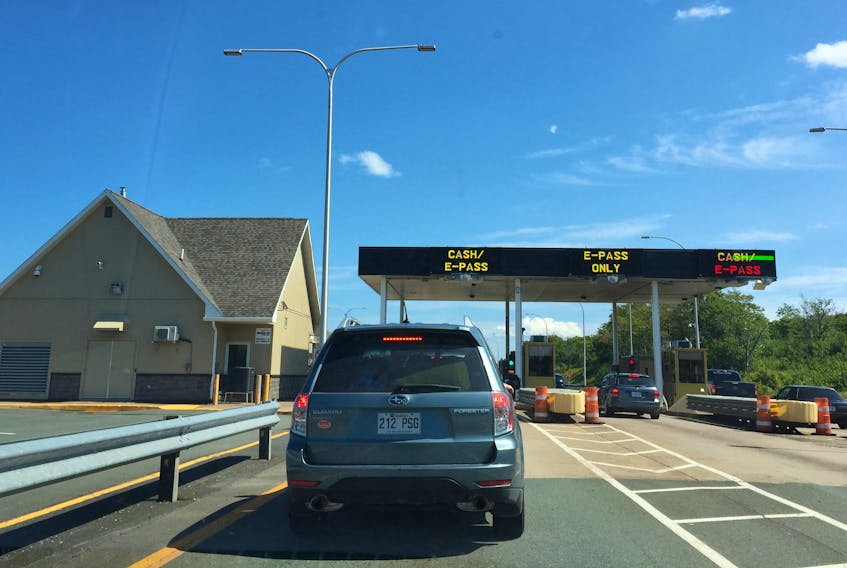 Cars wait to pay the toll at the Cobequid Toll booths at the Cobequid Pass in August 2017.